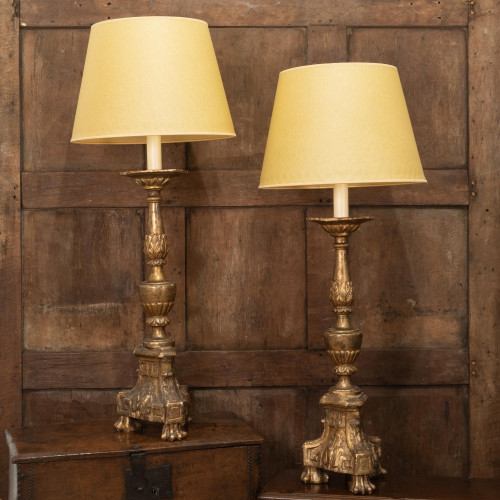 A pair of 18th century giltwood pricket candlesticks, Italian, converted to impressive table lamps