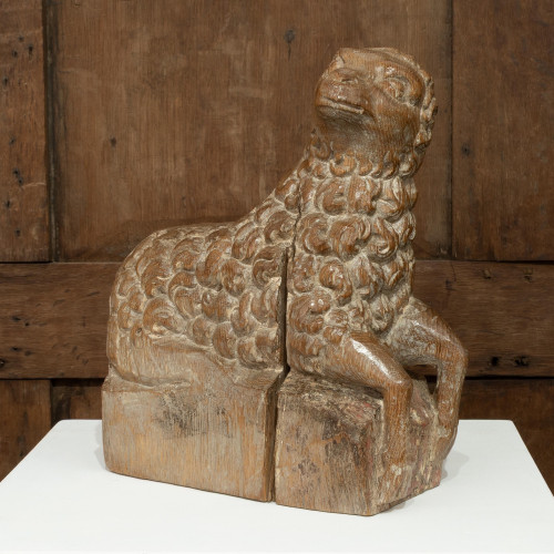 A wonderful 15th century carved oak lamb, English, circa 1480