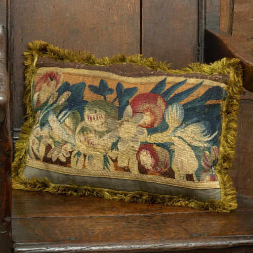 A cushion of 17th century tapestry border