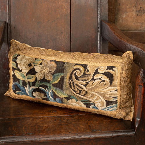 A cushion of 17th century tapestry border