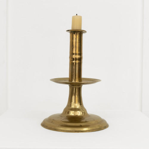 A documented mid-17th century brass trumpet-base candlestick, English, circa 1650