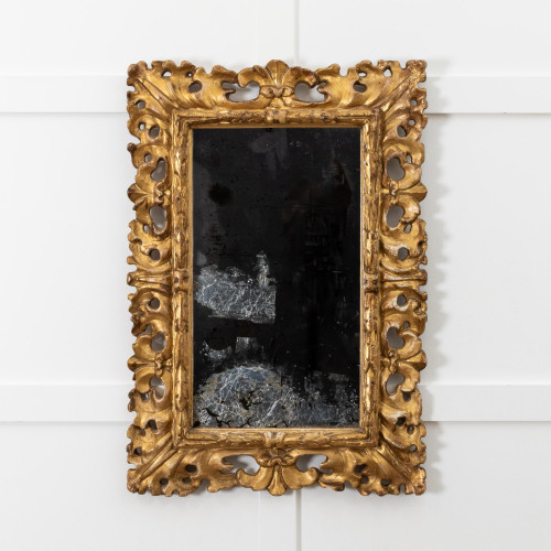 An early 19th century carved giltwood wall mirror, in the Florentine manner, circa 1830