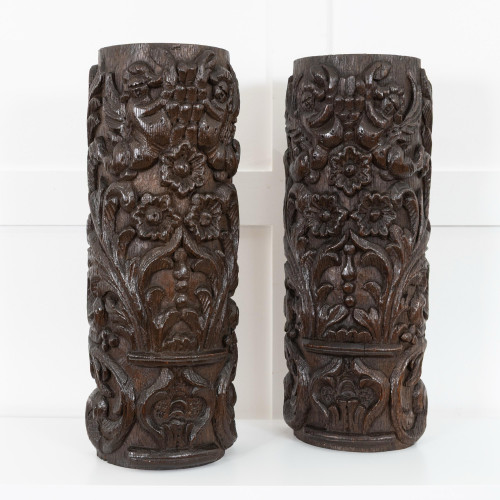 A pair of early 17th century carved oak pilasters, circa 1600