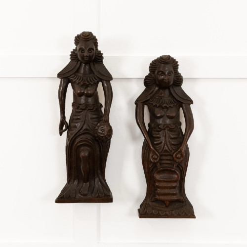 A pair of highly unusual Elizabeth I carved oak figures, circa 1580