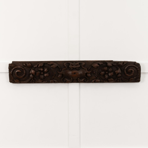 A 17th century carved oak panel, Flemish, circa 1640