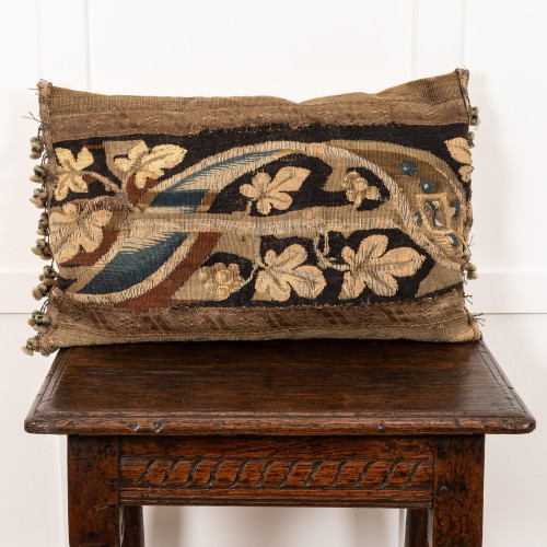 A cushion of 17th century tapestry border