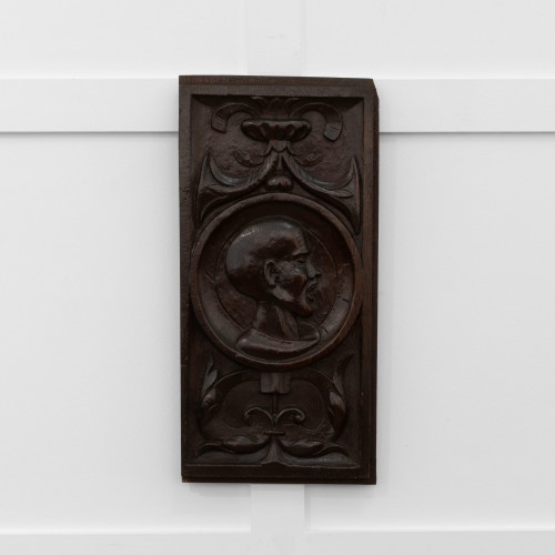 An unusual Henry VIII carved oak Romayne-type portrait panel, circa 1530-40