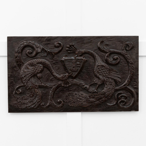 A Charles II carved oak heraldic carved panel, circa 1660