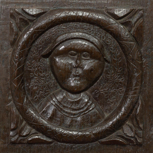 A rare and charming Henry VIII carved oak panel, circa 1520