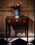 A pretty mid-18th century, oak lowboy with lappets and fruitwood inlay