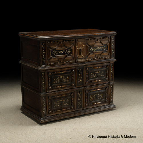 An exceptionally rare, mid-late-17th century, oak, bone and ebonized chest of drawers with enclosed upper section