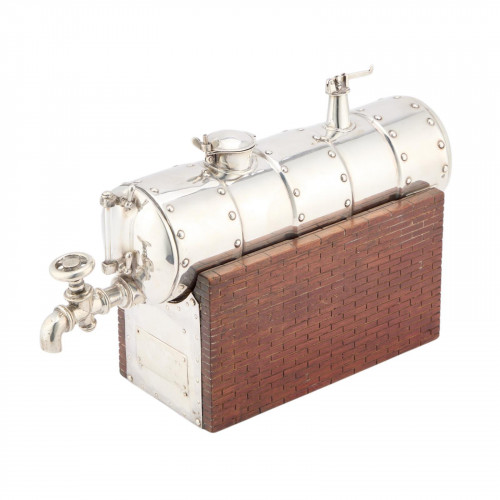 A CONTINENTAL SILVER NOVELTY DECANTER
CIRCA 1900 IN THE FORM OF A STEAM ENGINE