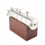 A CONTINENTAL SILVER NOVELTY DECANTER
CIRCA 1900 IN THE FORM OF A STEAM ENGINE BOILER