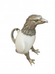 Victorian style silver plated claret jug in the form of a standing eagle (White glass)
