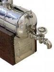 A CONTINENTAL SILVER NOVELTY DECANTER
CIRCA 1900 IN THE FORM OF A STEAM ENGINE BOILER