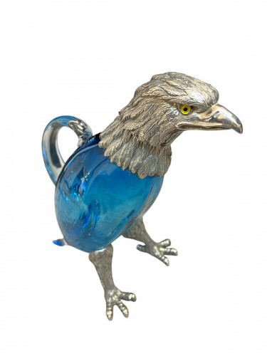 Victorian style silver plated claret jug in the form of a standing eagle (Blue glass)