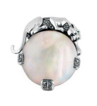 Sterling Silver Panther Brooch in an Art Deco Style With Mother Of Pearl Marcasite And Emerald Eyes