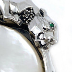 Sterling Silver Panther Brooch in an Art Deco Style With Mother Of Pearl Marcasite And Emerald Eyes