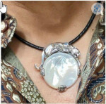 Sterling Silver Panther Brooch in an Art Deco Style With Mother Of Pearl Marcasite And Emerald Eyes