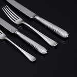 Set of hand-forged George IV Old English Thread silver cutlery for 12