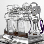 Two-bottle Edwardian silver tantalus set
