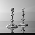 Pair of Queen Anne cast Britannia silver candlesticks