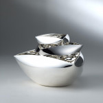 Large triangular-topped silver bowl