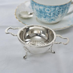 Silver tea strainer & stand