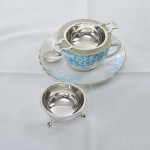 Silver tea strainer & stand
