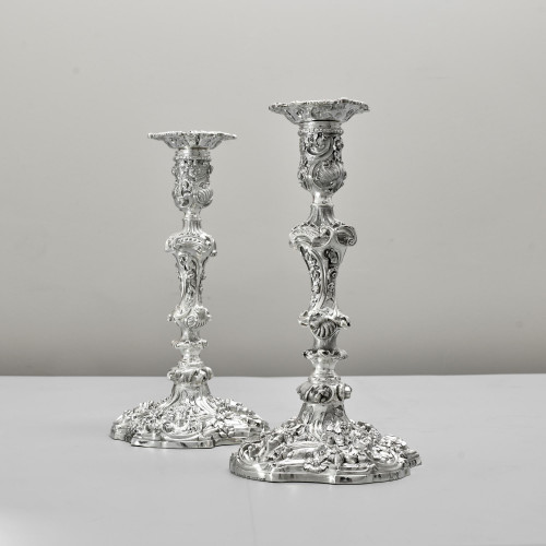 Pair of impressive antique cast silver candlesticks by royal silversmith