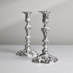 Pair of impressive antique cast silver candlesticks by royal silversmith