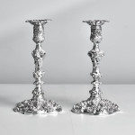 Pair of impressive antique cast silver candlesticks by royal silversmith