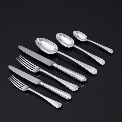 Set of hand-forged one-date-and-maker antique Featheredge pattern stering silver cutlery for 12