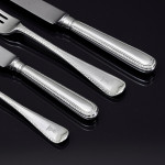 Set of hand-forged one-date-and-maker antique Featheredge pattern stering silver cutlery for 12