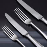 Set of antique hand-forged Rattail pattern sterling silver cutlery for 12