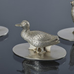 Set of four antique duck & grouse sterling silver menu holders