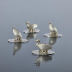 Set of four antique duck & grouse sterling silver menu holders