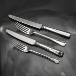 Set of hand-forged 4-prong Rattail pattern sterling silver cutlery for 12 in canteen
