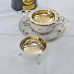 Two-handled sterling silver tea strainer & drip bowl