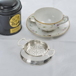 Two-handled sterling silver tea strainer & drip bowl