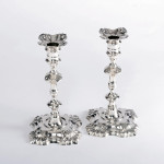 Pair of George II cast sterling silver candlesticks