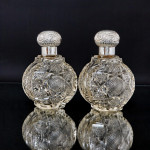 Pair of large Victorian cut glass & sterling-silver-mounted perfume bottles