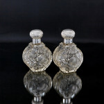 Pair of large Victorian cut glass & sterling-silver-mounted perfume bottles
