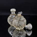 Pair of large Victorian cut glass & sterling-silver-mounted perfume bottles