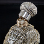 Pair of large Victorian cut glass & sterling-silver-mounted perfume bottles