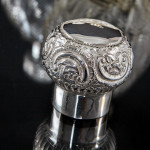 Pair of large Victorian cut glass & sterling-silver-mounted perfume bottles