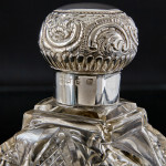 Pair of large Victorian cut glass & sterling-silver-mounted perfume bottles