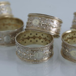 Set of six Victorian parcel-gilt sterling silver napkin rings