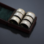 Set of six Victorian parcel-gilt sterling silver napkin rings