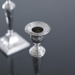 Pair of small square-based neoclassical style sterling silver candlesticks
